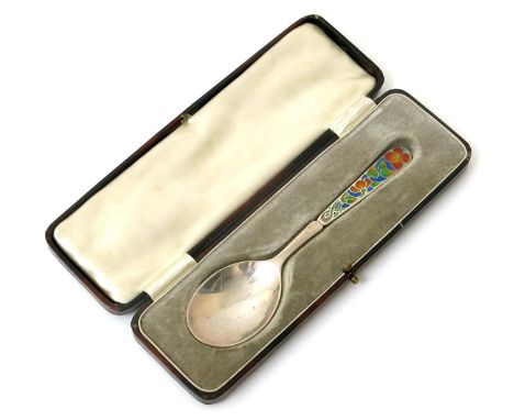 A Bernard Instone silver and enamel spoon,  the flaring stem enamelled with a floral entrelac motif in colours, in presentati
