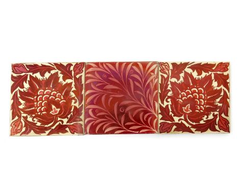 A William De Morgan Flying Leaf tile on Wedgwood bank,  painted with a scroll foliate design in ruby lustre on a cream ground