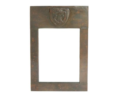 A rare Liberty & Co patinated copper wall mirror designed by Archibald Knox,  rectangular form, stamped in relief with a styl