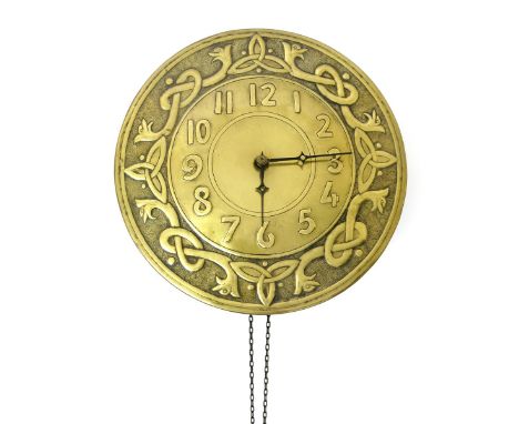 A Glasgow School brass clock the design attributed to  Margaret Gilmour, the circular dial cast in low relief with interlinke
