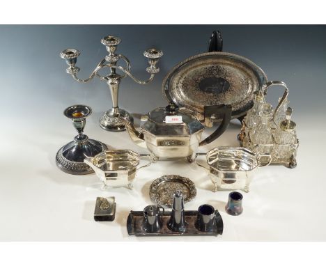 A quantity of electroplate including a three-piece tea set, candelabrum, cruet sets etc