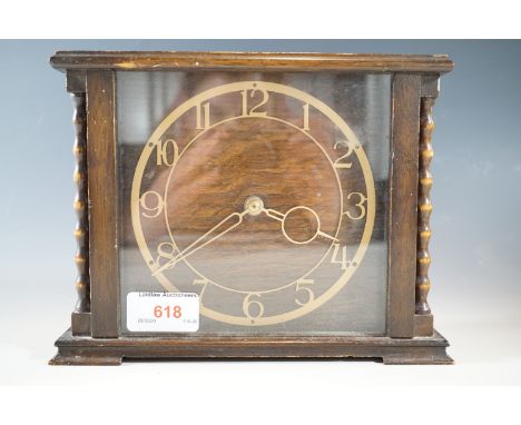 A 1920s oak mantle clock, 16 cm high