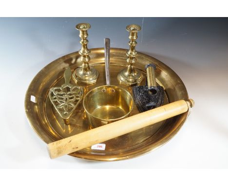 Victorian and later domestic ware including a large brass tray, brass pan, sad iron and stand, candlesticks and rolling pin