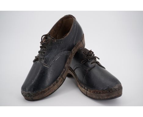 A vintage pair of wooden dancing clogs 
