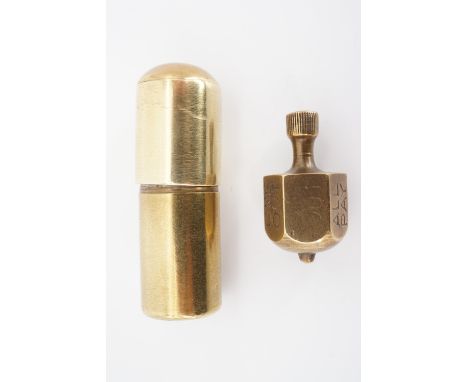 A trench art cigarette lighter and brass Put and Take gambling game spinner