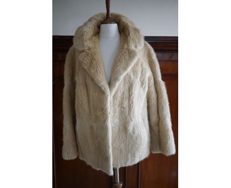 A vintage blonde musquash fur swing jacket retailed by M. Fletcher of Southport, having bracelet length sleeves, together wit