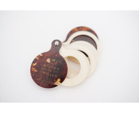 A vintage H. Samuel faux tortoiseshell and ivorine ring sizer, bearing the advertising slogan '"Happiness" Engagement Rings &