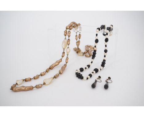 A pair of Victorian jet ear pendants, a jet and faux pearl necklace, and a 1920s lustrous bead rope necklace 