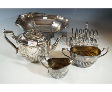 A three-piece electroplate tea set, basket and toast rack