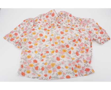 A 1930s lady's blouse, printed with pink and red stylized carnations, 36" bust