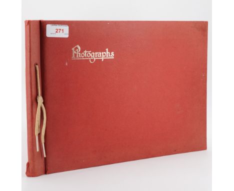 A vintage photograph album containing photographs of steam locomotives with hand-annotated inscriptions and classifications, 