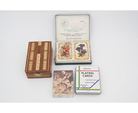 A cribbage set together with vintage Piatnik and other playing cards