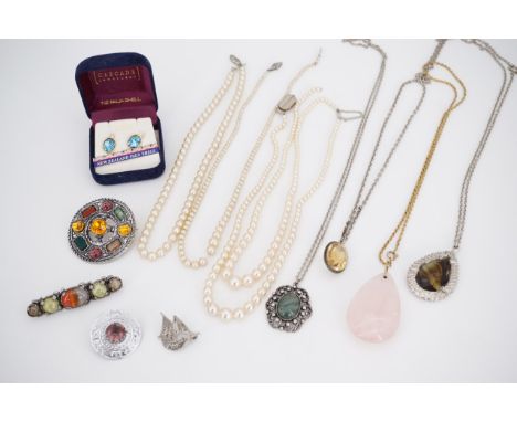 A quantity of vintage costume jewellery, including paste pebble brooches, and faux pearl necklaces