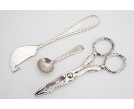 An electroplate citrus peeler, tongs and salt spoon