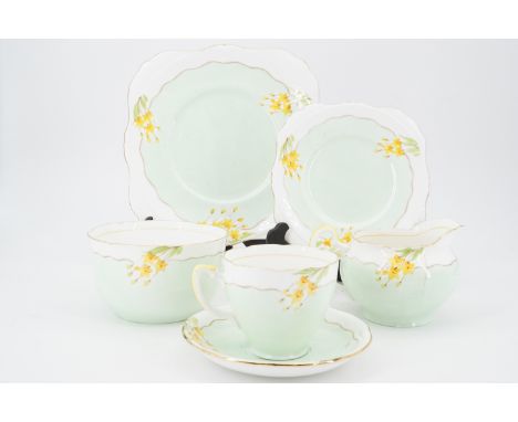 A 1930s Grafton china tea set for ten, decorated with daffodils, pattern No. 6307