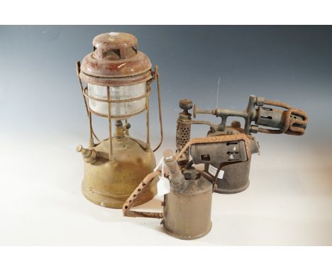 A Tilley lamp and two blow lamps