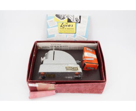 A 1950s Lucas Minicine toy slide projector, boxed with slides