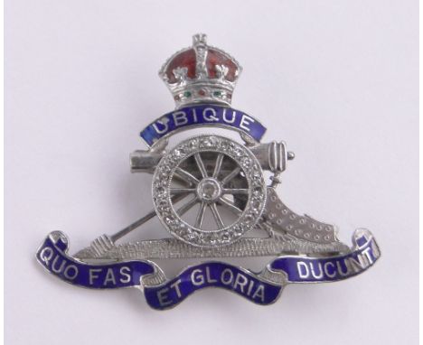 An 18ct gold, platinum enamel and diamond Military Sweetheart brooch, length 34mm.