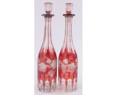 A pair of 19th century ruby flash glass decanters, etched grapevine designs, height 35cm.