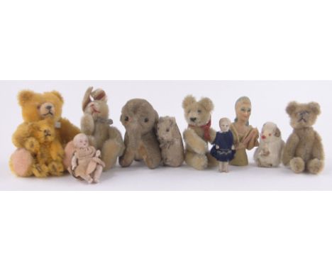 A collection of miniature Vintage teddies and dolls.