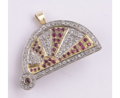 An 18ct gold ruby and diamond set fan design brooch/pendant, length 35mm, 10.7g.