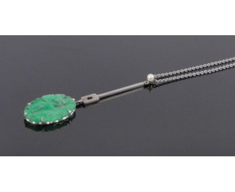 A 9ct white gold pendant with carved and pierced jade panel on white gold chain, pendant length 55mm.