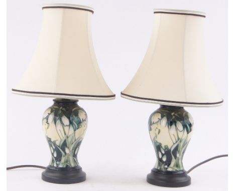 Pair of modern Moorcroft snowdrop design table lamps, base height excluding fitting 20cm.