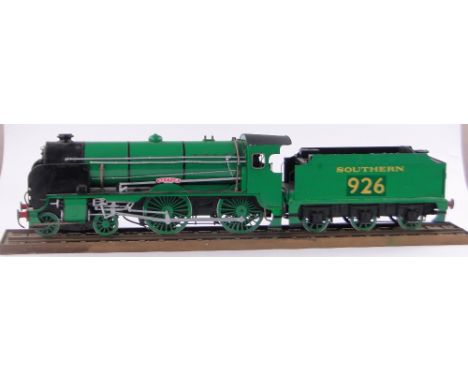 A large wooden framed scratch-built model steam railway engine and tender, on section of track, base length 105cm.