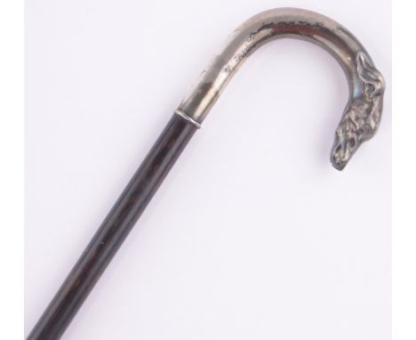 A 19th century continental silver dog's head handled walking stick, continental hallmarks.