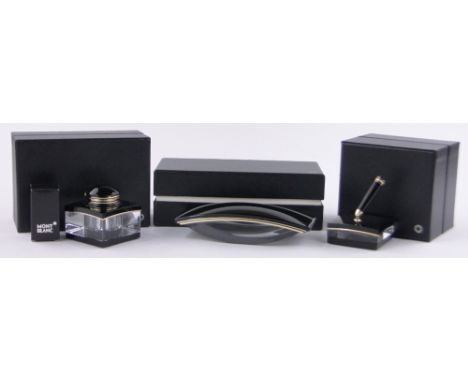 A Mont Blanc inkwell, desk blotter and pen stand, new and unused condition, all boxed with papers, (3 boxes).