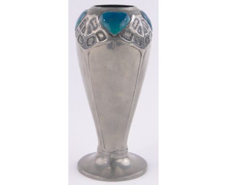 A Liberty Tudric Art Nouveau pewter vase, turquoise enamel heart shaped plaques to the rim with stylised relief tree designs,