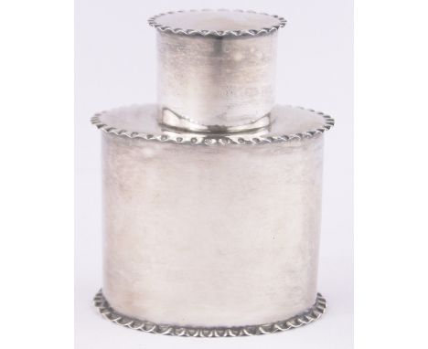 A small oval silver tea caddy, with frilled edges, Chester 1912, height 8cm.