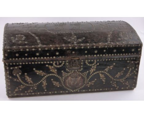 A 19th century leather bound domed top travelling trunk, applied brass leaf decoration and brass stud work, length 81cm.