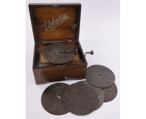 A 19th century edelweiss polyphon, stained wood case playing 20cm discs, together with 6 discs, case width 31cm.