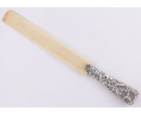 A relief embossed silver handled ivory page turner, Jack & The Beanstalk design, makers marks JKSJ, London 1888, length 34cm.