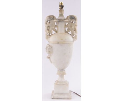 A relief carved alabaster table lamp, early 20th century, height excluding fitting 60cm.