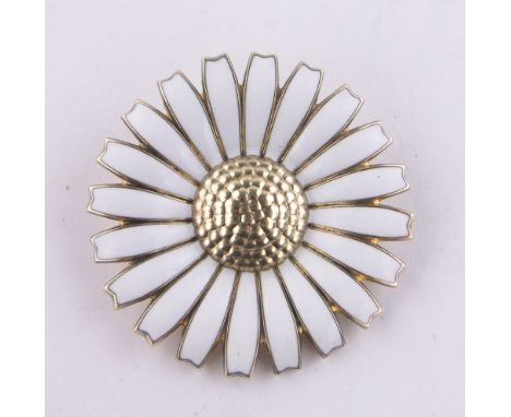A Georg Jensen silver and white enamel daisy brooch, 43mm across.