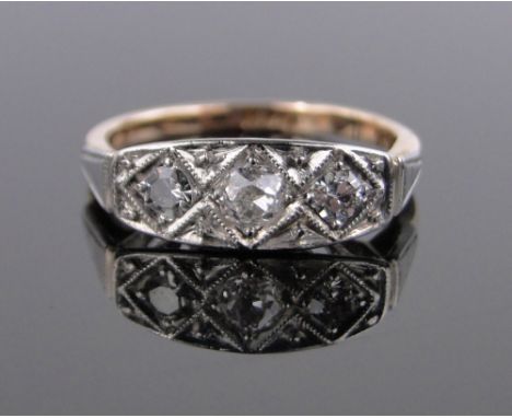 An Art Deco 18ct gold and platinum 3 stone diamond ring, total diamond content approx. 0.5cts, setting width 15mm, size K.