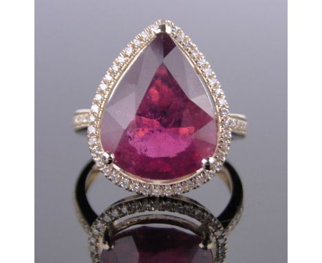 A 14ct gold 9ct pear-cut ruby ring surrounded by diamonds, total diamond content approx. 0.5cts, setting height 20mm, size M.