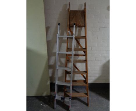 An aluminium extension ladder together with a wooden folding ladder 