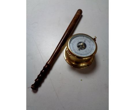 A brass cased ship's style barometer together with a turned wooden truncheon  