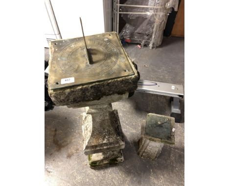 A sundial on weathered concrete pillar signed Thomas Grice and dated 1705, together with another very similar sundial on conc