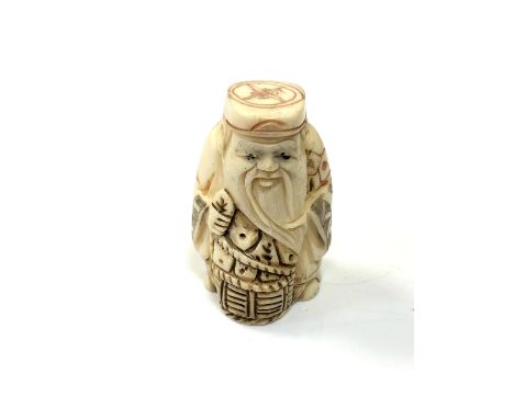 A carved Chinese bone netsuke - Elderly man holding a basket 