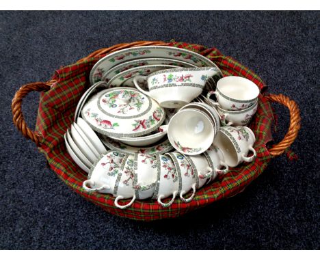 A wicker hamper containing a Johnson Brothers Indian tree dinner service 