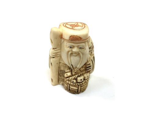 A carved Chinese bone netsuke - Village elder holding a staff