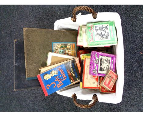 A box of play one die cast vehicles including Tonka, together with a wicker hamper containing playing cards, puzzles, board g
