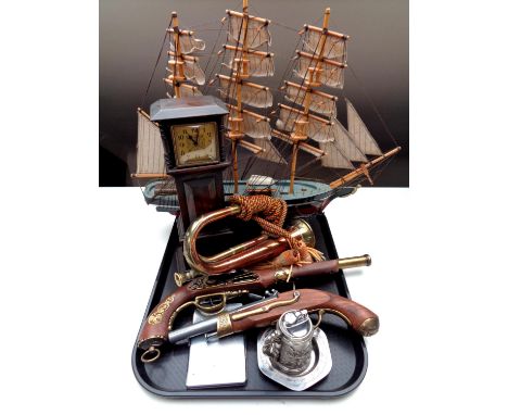 A tray containing model of a three masted sailing ship, copper and brass bugle, two replica flintlock pistols, miniature long