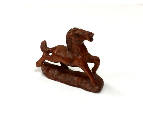 A carved Chinese hardwood netsuke - Small foal