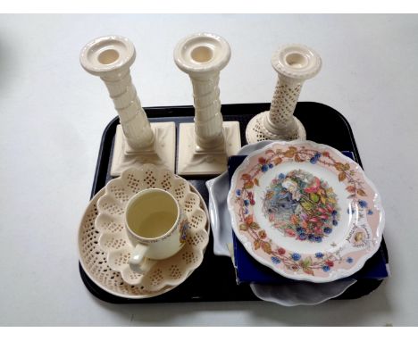A tray containing a pair of Royal Creamware candlesticks, a further pierced candlestick, two Creamware bowls, Royal Doulton A
