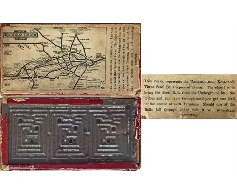 c1909 London Underground PUZZLE featuring the official UndergrounD map on the top of the box. The game is to get 3 steel ball